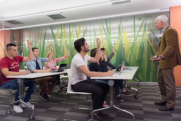 Image showing teacher with a group of students in classroom