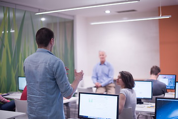 Image showing student answering a question in classroom