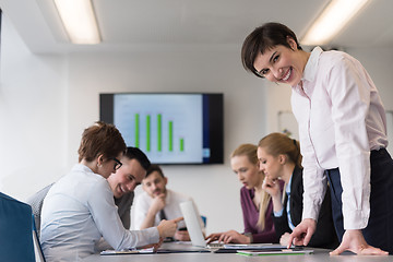 Image showing young  woman using  tablet on business meeting