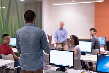 Image showing student answering a question in classroom