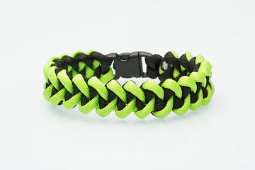 Image showing green braided bracelet on white background