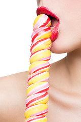 Image showing Close-up shot of woman\'s mouth bright red lips with lollipop. blowjob simulation