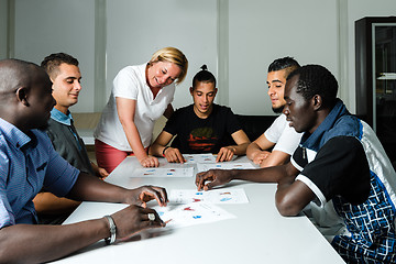 Image showing Language training for refugees in a German camp 