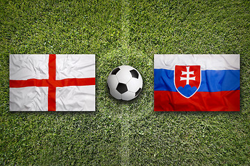 Image showing England vs. Slovakia flags on soccer field