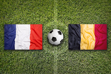 Image showing France vs. Belgium flags on soccer field