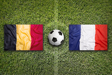 Image showing Belgium vs. France flags on soccer field