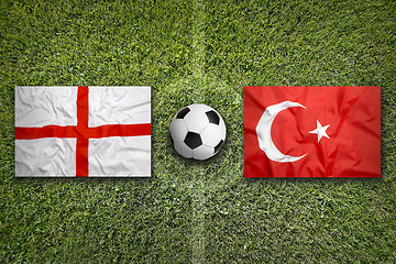 Image showing England vs. Turkey flags on soccer field