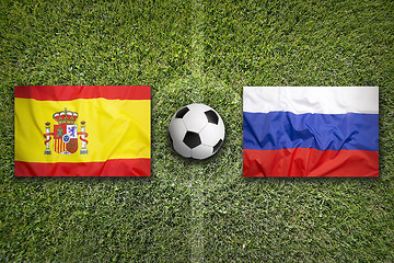 Image showing Spain vs. Russia flags on soccer field