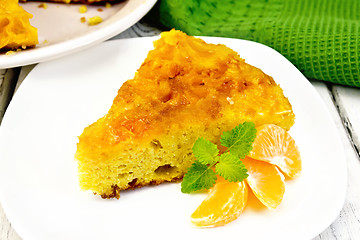 Image showing Pie mandarin with mint on table