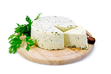 Image showing Cheese homemade with parsley on round board