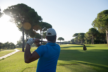 Image showing golf player hitting shot