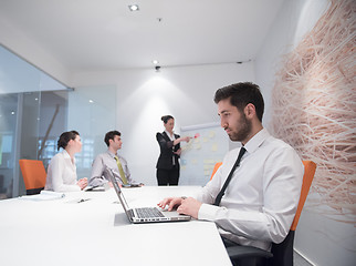 Image showing young business man at meeting