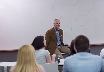 Image showing teacher with a group of students in classroom