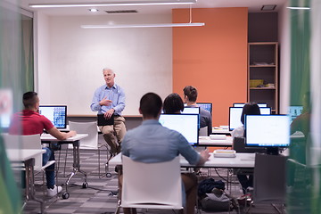 Image showing teacher and students in computer lab classroom