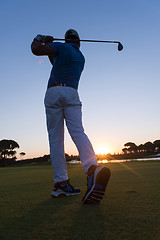 Image showing golfer hitting long shot