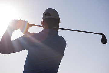 Image showing golf player hitting shot