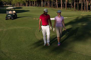 Image showing couple walking on golf course