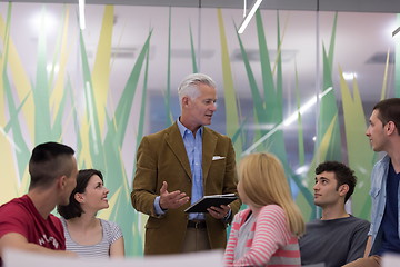 Image showing teacher with a group of students in classroom