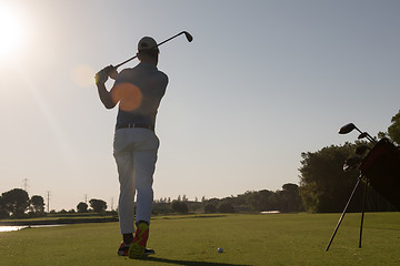 Image showing golf player hitting shot