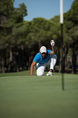 Image showing golf player aiming perfect  shot