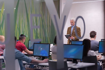 Image showing teacher and students in computer lab classroom