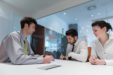 Image showing young couple signing contract documents on partners back