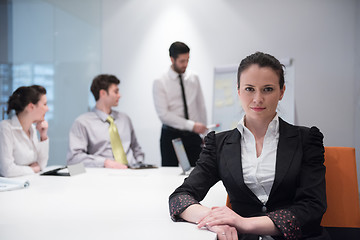 Image showing young business woman on meeting  using laptop computer