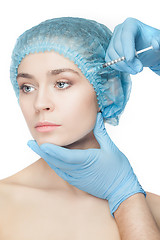 Image showing Attractive woman at plastic surgery with syringe in her face