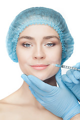 Image showing Attractive woman at plastic surgery with syringe in her face