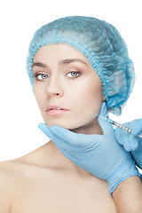 Image showing Attractive woman at plastic surgery with syringe in her face