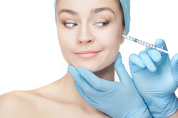 Image showing Attractive woman at plastic surgery with syringe in her face