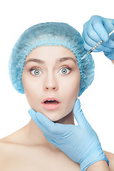 Image showing Attractive woman at plastic surgery with syringe in her face