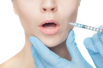 Image showing Attractive woman at plastic surgery with syringe in her face