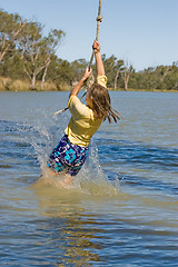 Image showing girl swinging