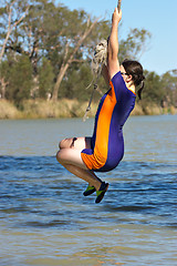 Image showing girl swinging