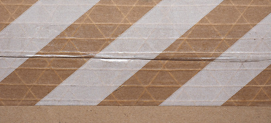 Image showing Packet parcel with striped tape