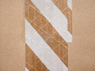 Image showing Packet parcel with striped tape