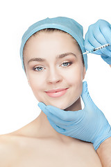 Image showing Attractive woman at plastic surgery with syringe in her face