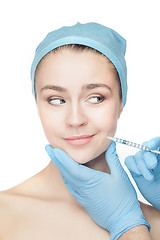 Image showing Attractive woman at plastic surgery with syringe in her face