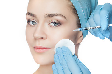 Image showing Attractive woman at plastic surgery with syringe in her face