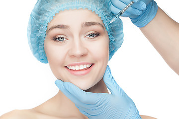 Image showing Attractive woman at plastic surgery with syringe in her face