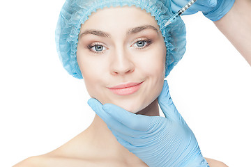 Image showing Attractive woman at plastic surgery with syringe in her face