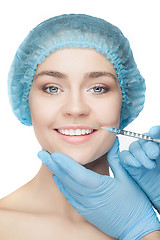 Image showing Attractive woman at plastic surgery with syringe in her face