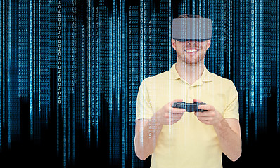 Image showing happy man in virtual reality headset with gamepad