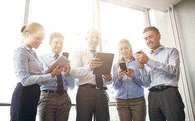 Image showing business people with tablet pc and smartphones