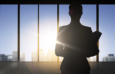 Image showing silhouette of business woman with folders