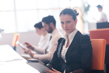 Image showing business woman on meeting  using tablet