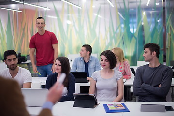 Image showing teacher with a group of students in classroom