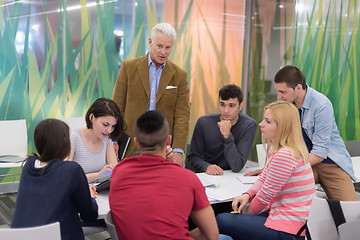 Image showing teacher with a group of students in classroom