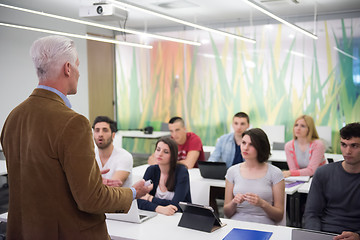 Image showing teacher with a group of students in classroom